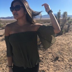 Green pleated off-the-shoulder blouse